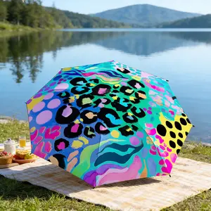 Portable folding umbrella The umbrella features vibrant abstract patterns with leopard spots, circles, and wavy lines in various bright colors. Suitable for daily travel use, holiday Gift