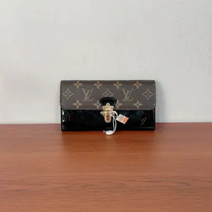 Pre-owned pvc Clutches & Wristlets Louis Vuitton Black Brown Long Wallet qiqicj7122