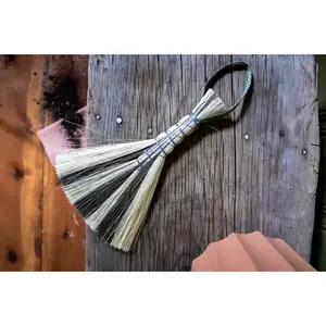 Metal wrapped brushes and brooms