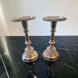 silver-toned metal candelabra is decorated with crystals Both Tapered And Pillar