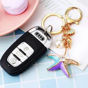 Pearl shell and starfish car keychain, women's bag pendant, metal keyring with high-quality electroplating process, securely inlaid with rhinestones, gift