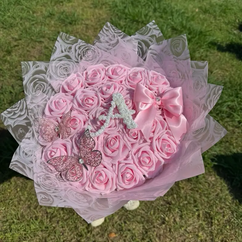 Pink eternal roses with custom baby breath letter Pink eternal roses with custom baby breath letter