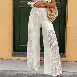 Women’s summer solid-color wide-leg pants with lace panels, elastic drawstring waist, side seams, and floral lace cutouts—ideal for beach vacations and beachwear.