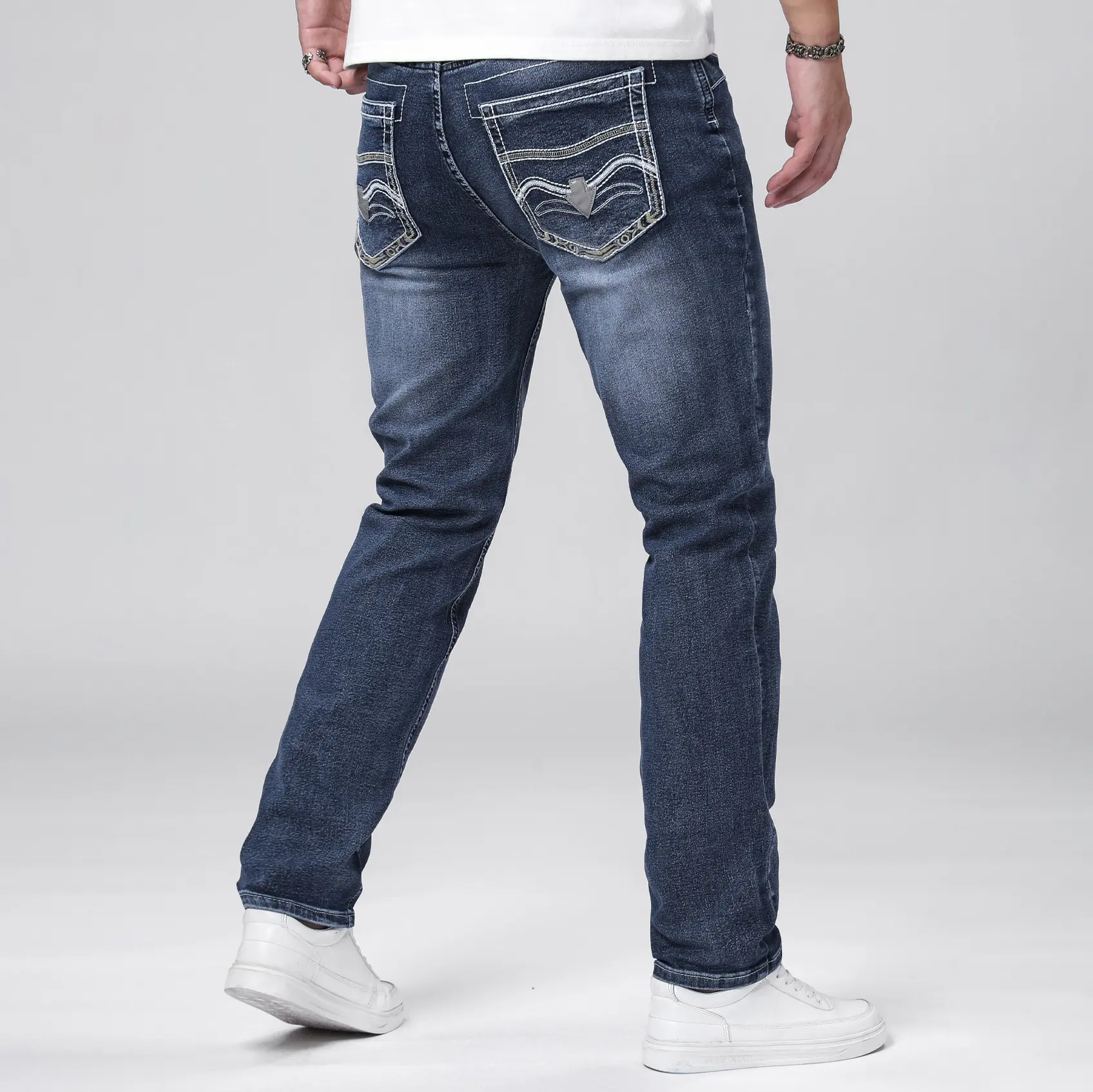 Men’s stretch washed jeans with back pocket wavy embroidery, straight slim fit, trendy casual long pants.