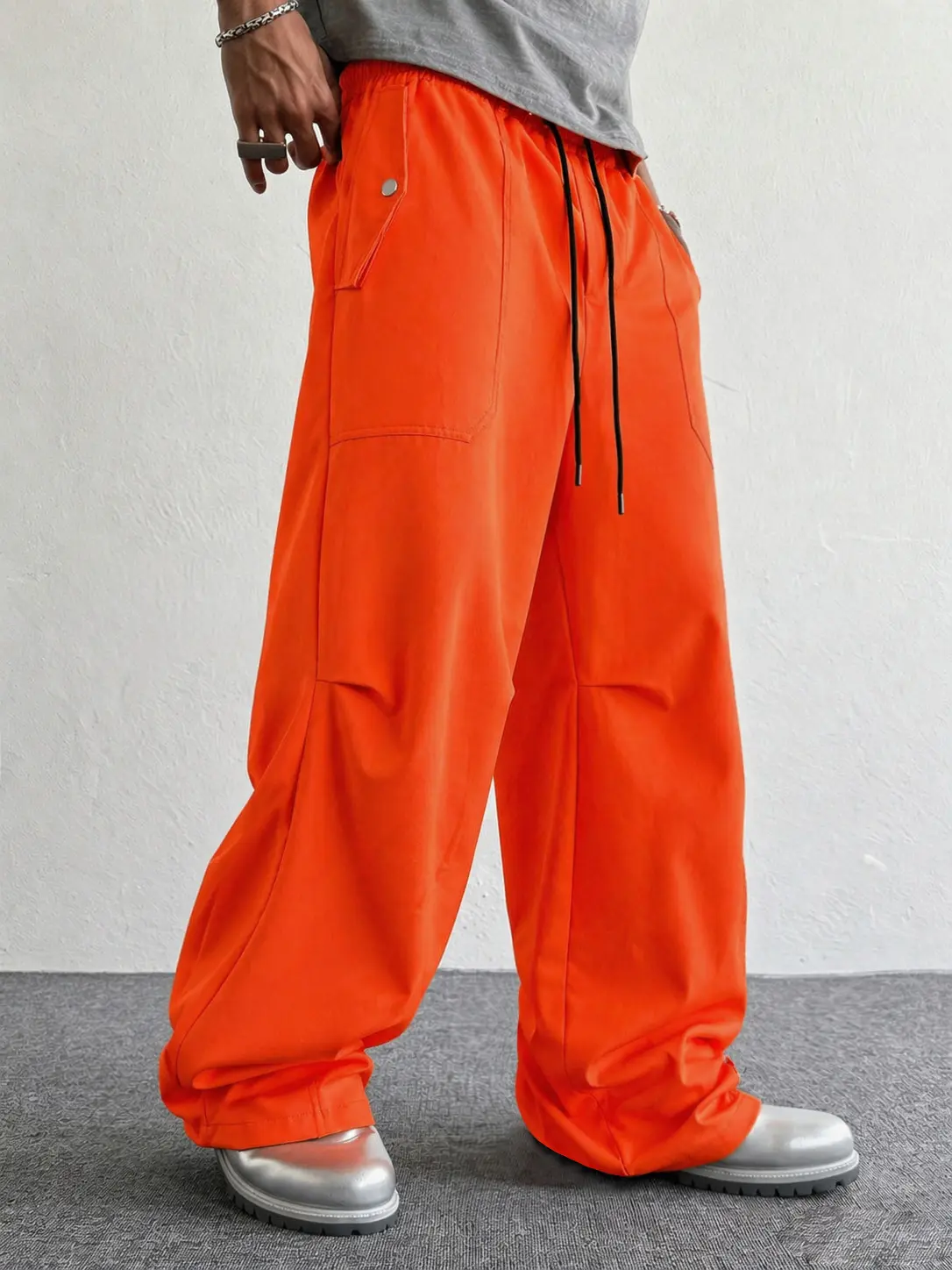 Men’s high-waisted baggy pants, orange, casual loose fit athletic trousers with deep pockets for urban street style