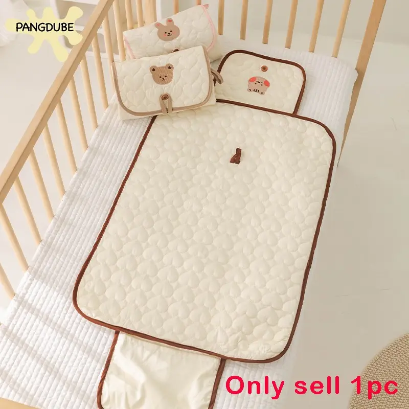 Cream Bear-Patterned Portable Diaper Changing Pad, Foldable and Breathable Polyester with Adjustable Strap for Newborn Travel, Secure Closure and Diaper Pouch