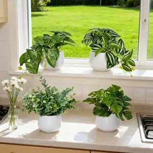 Set of 4 Potted Artificial Plants Featuring A Variety of Leaf Shapes. Perfect for Home Decor, They Can Be Placed on Windowsills or Tabletops To Add Natural Vitality To Spaces Such As Living Rooms. Requiring No Maintenance, Artificial faux greenery