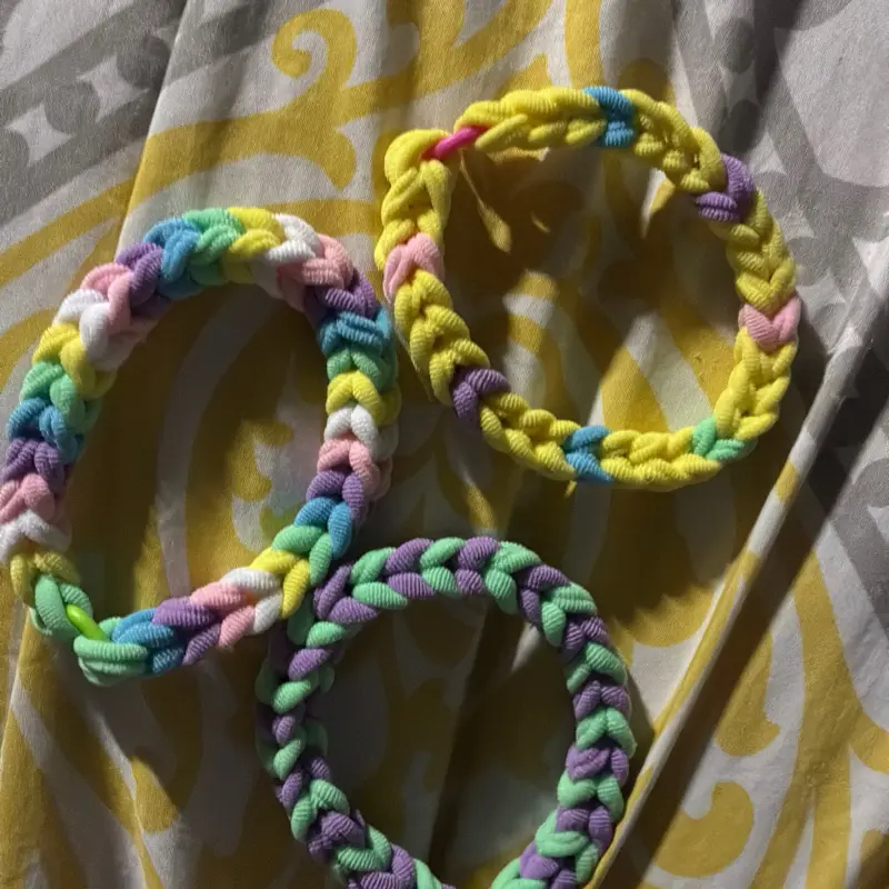 Three rainbow loom bracelets priced at three dollars for one nine dollars for all three