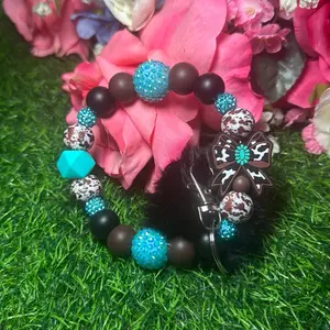 Sweet cowhide wristlet keychain color scheme black, turquoise, cowhide, chocolate and bling beads made with  wire