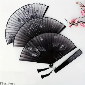 Stylish vintage bamboo folding fan with tassel - Portable handheld summer fan, perfect for celebrations, events, and gifts.  Features a solid color design with floral details.  Event accessory | Decorative fan | Easy-to-carry fan