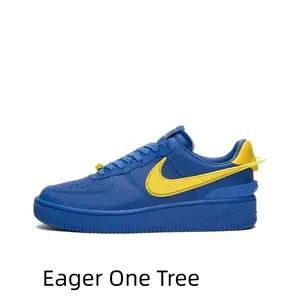 Unisex hip-hop low-top casual sports sneakers in solid royal blue leather, bright yellow side ornament, perforated breathable toe and matching blue wear-resistant rubber outsole.