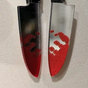 Chucky doll and knife earring set