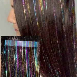 InstaTinsel strips:heat fuse under a light layer of hair for up to 6 weeks- like tape-in hair extension. Remove and slide off with a dab of alcohol on the adhesion.  Wash & heat style.  30 colors.  3 lengths for hair that is 20 in. or 30 inches. Reusable.