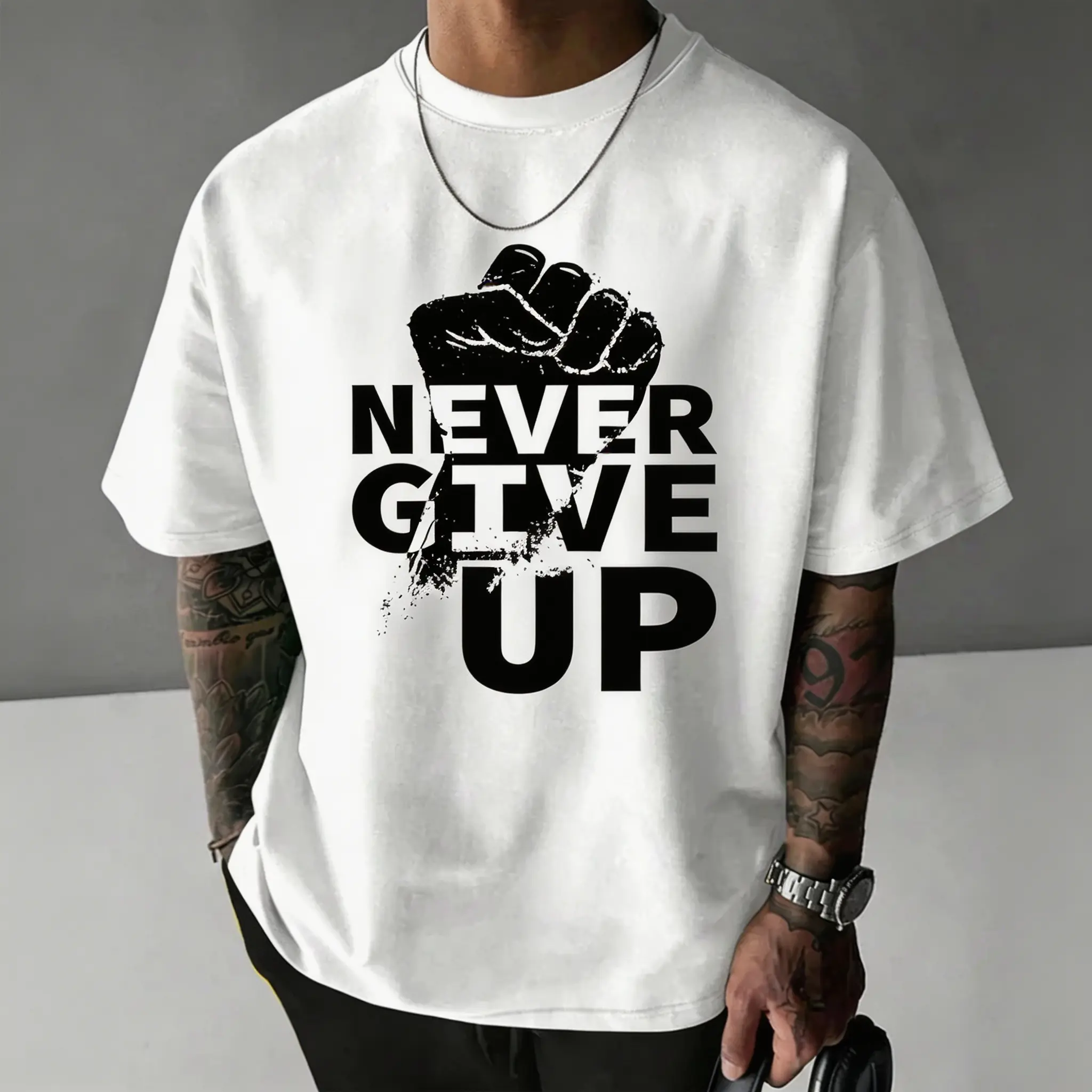 “Power Fist Never Give Up” graphic tee — positive mindset, inspirational short-sleeve top made from soft premium cotton, crew neck, loose fit, casual outfit for teenagers, men, and women; daily encouragement; personality statement clothing; black single c