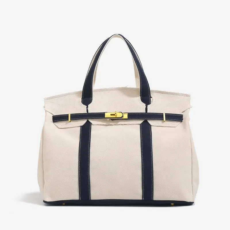 Canvas Platinum Bag for Women 2026 NewHigh-End Niche Design Color-Block HandbagLarge Capacity Commuter Versatile, Vintage distressed thread design, highlighting unique texture.