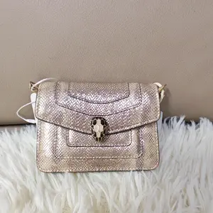 Pre-owned france Clutches & Wristlets Bvlgari—Champagne Gold Snake Head Coin Purse（SZ 02911 ）