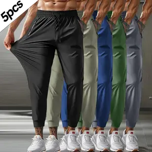 Men’s jogger pants 5-pack, solid color, breathable ice silk stretch fabric, featuring a drawstring waistband and zippered pockets. Casual nine-tenth pants are perfect for weekend outings, workouts, and outdoor activities.