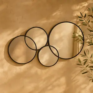 CosmoLiving by Cosmopolitan Black Metal Bubble Cluster Room Wall Mirror