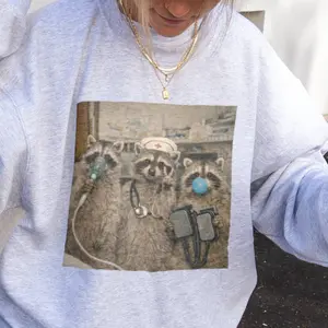 Bojjico Emergency Room Nurse Raccoon Sweatshirt & Graphic Tee for Women Funny Quirky Retro Medical Humor Aesthetic Beige Cream Cotton Blend Comfort Colors Tee Sweatshirt ER Nurse Gift Emergency Department Team Shirt Feral Raccoon Apparel