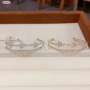 Zircon Petal Flower Open Cuff Bracelet  A delicate and feminine bracelet that captures the beauty of a blooming flower in full sparkle. Featuring a stunning open cuff design adorned with petal-shaped cubic zirconia crystals, this elegant piece adds a touc