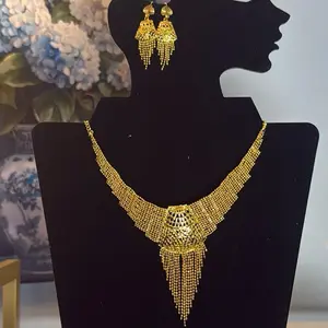 Gold tone imitation necklace place set