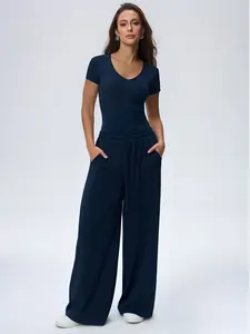 Women's slim fit round neck short sleeved top and high waisted elastic wide leg trousers set a stylish and versatile two piece outfit for casual and commuting wear designed to flatter the figure