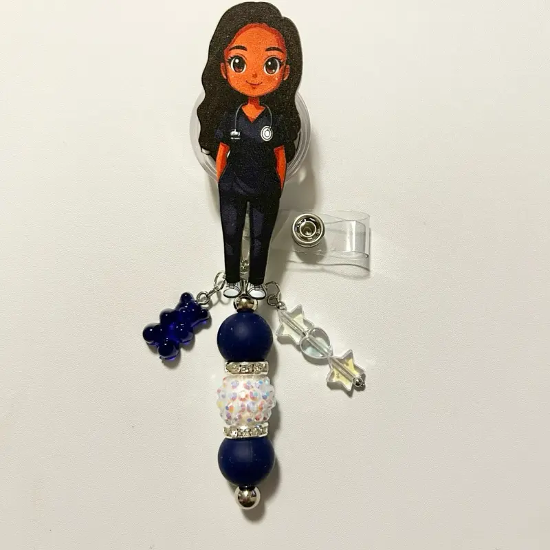 Charmed- Cute trendy retractable badge reel with alligator clip and colorful beads. Charms may vary from photo but will match colors in acrylic piece.