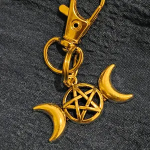 Moringa Maiden Keychain with crescent moons and pentagram