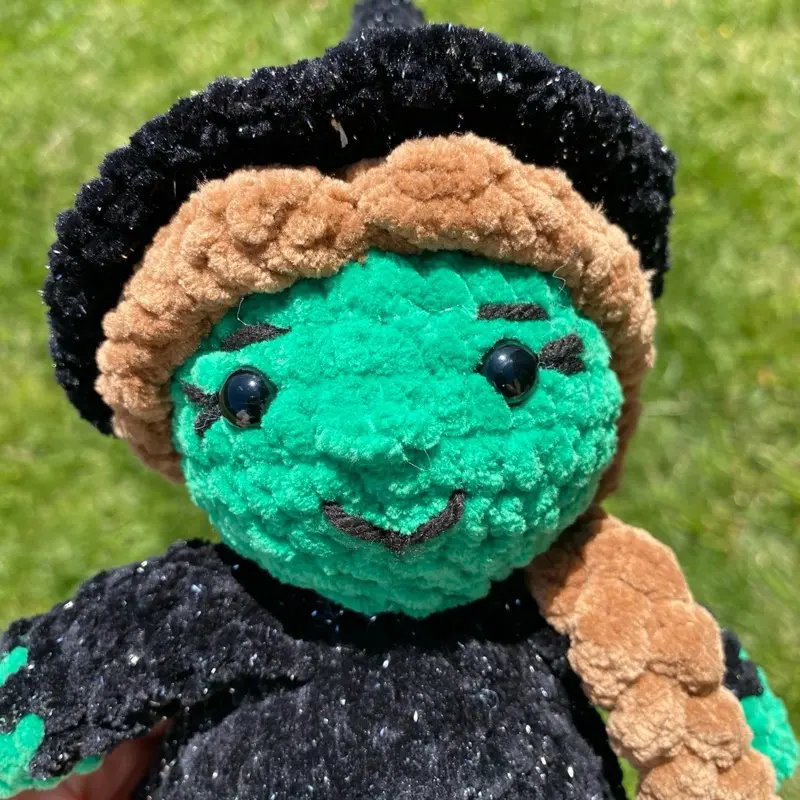 Handmade Crochet Green Witch's Plushie - Super Soft, Green Color, Black Headpiece, Brown Hair, Simple Design, Ideal for Collectors and Gifts