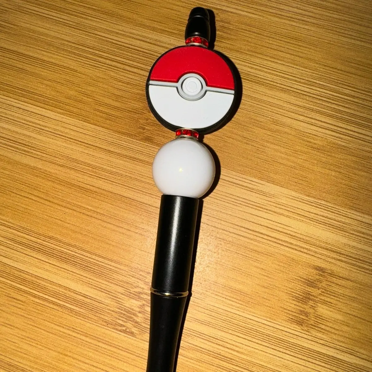 Poke ball focal bead pen