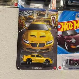 Hot Wheels '06 Pontiac GTO Yellow Diecast Car Model Collectible Toy Vehicle