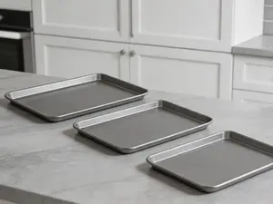 3-piece nonstick baking sheet set in assorted sizes. Durable carbon steel bakeware for daily baking use.