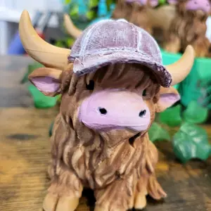 3D-printed Highland Cow Figurine with Detailed Fur Texture and Hat Accessory for Home Decor