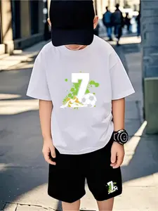 Dynamic Soccer Digital Print Short-Sleeve T-Shirt and Shorts Set for Boys - Black base with a white “17” and vibrant green wave design, perfect for young athletes and ideal for outdoor activities