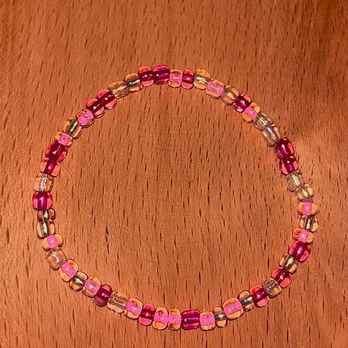 Transparent pink themed beaded bracelet