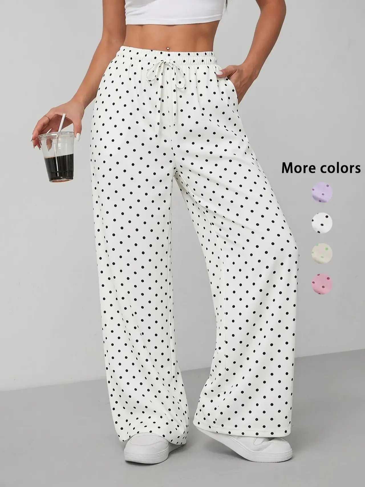 Women’s drawstring elastic-waist polka dot wide-leg pants made from lightweight, soft, breathable fabric; side pocket design; loose, drapey fit; suitable for everyday casual wear and beach vacations; a versatile summer essential.