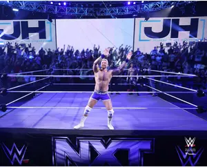 Joe Hendry WWE Unsigned Wave Your Hands Entrance Photograph