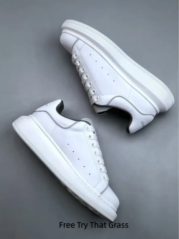 Minimalist full white smooth leather platform casual sneakers, matching white flat shoelaces, classic round toe with breathable side perforations, thick layered white shock-absorbing elevated midsole, grain anti-slip rubber outsole