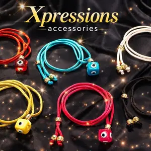 Knot bracelet with cord and cube eye pendants for stylish accessories