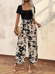 A women's elegant casual square-neck short-sleeved top with a bohemian floral print jumpsuit, a comfortable style for beach vacations and events.