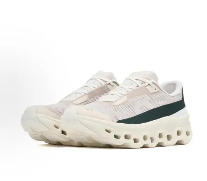 Cream forest green colorblock athletic sneakers featuring eye-catching hollow cushion midsole, lightweight woven mesh construction, ventilated perforated panels, durable rubber outsole, a trendy staple for vintage neutral streetwear fans
