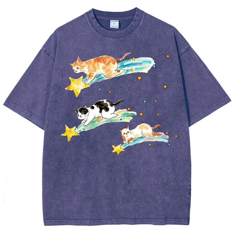 Y2K Kawaii Hand Drawn Watercolor Illustration Of Three Different Coat Pattern Kittens Sliding Down Glowing Shooting Star Comets, Scattered Tiny Yellow & Light Blue Star Accents Kawaii Cosmic Pet Lover Unisex Loose Fit Casual Streetwear Tee