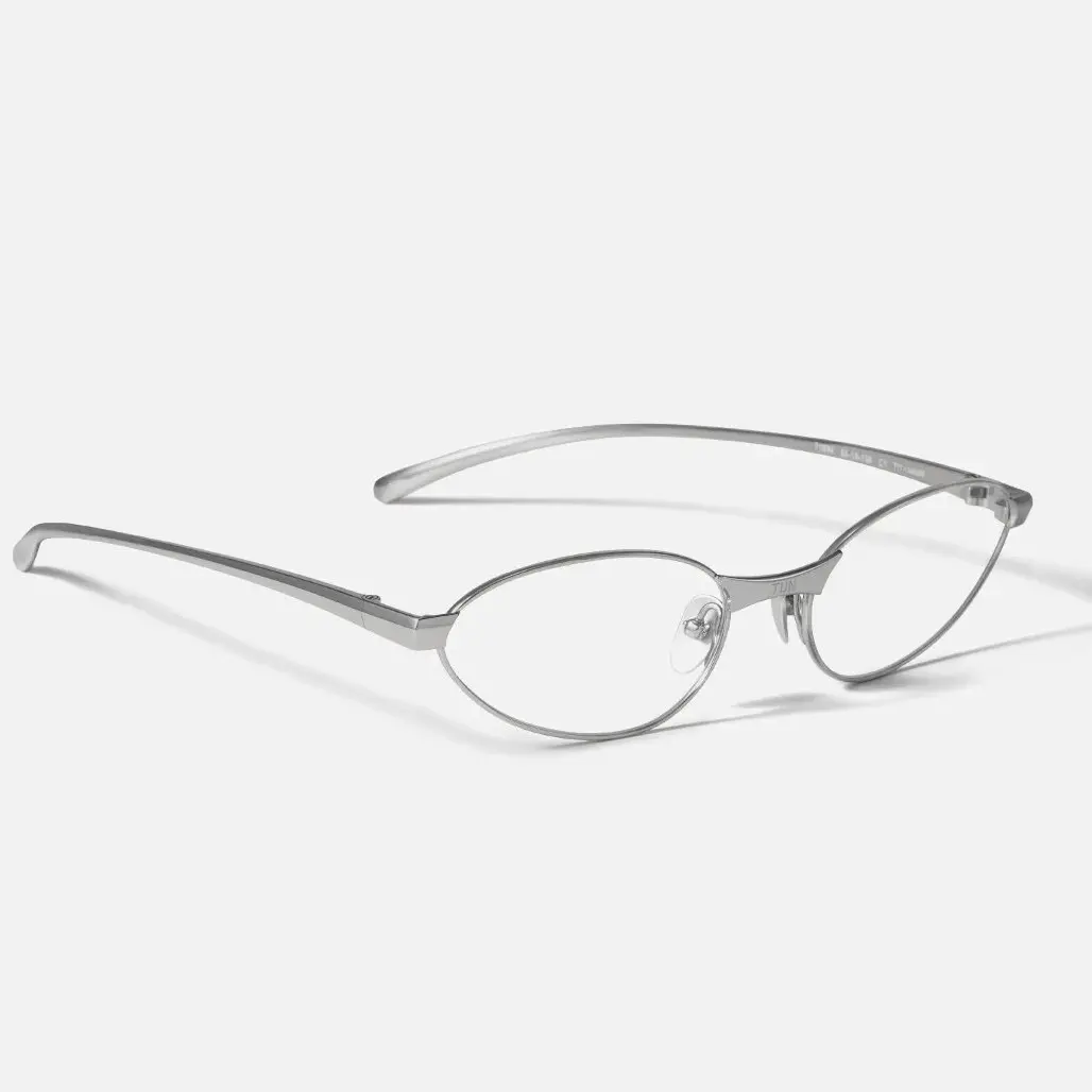 TIJN Sculptural titanium frame offering ultra-lightweight precision, refined micro-cat-eye oval minimalist glasses, avant-garde metal optical frames for women and men AETHER LINE / S01