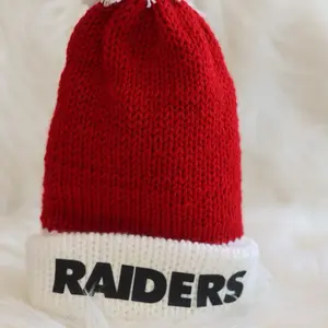 Winter Raiders Beanie with Red and White Color Scheme and a White Pom Pom.