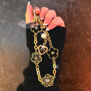 Elegant Flower Phone Wristlet Lucky Charm Pearl Heart Pendant Phone Chain Premium Anti-Lost Metal Hand Strap Universal Smartphone Fashion Accessory Perfect Gift for Women and Girls