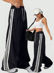 Black & White Striped Wide-Leg Pants | Wide Sweatpants | Oversized Drawstring Joggers – Streetwear! Bold Side Stripes, Comfy Relaxed Fit Perfect for #OOTD, #BaddieOutfits, #Y2KRevival. Stylish for Brunch, Hangouts or Casual Runs – Versatile Statement