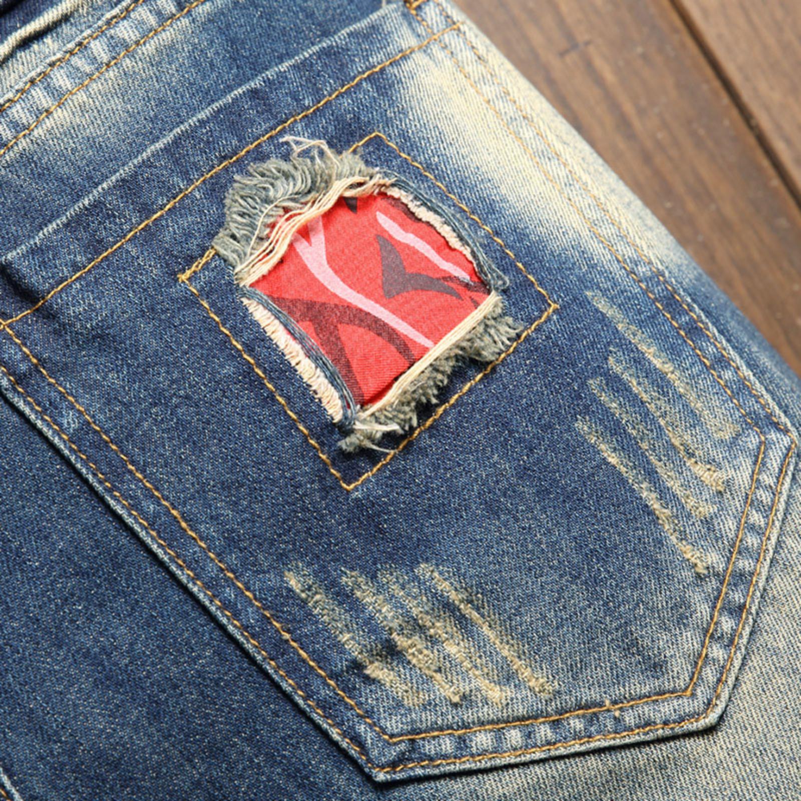 Bleached distressed denim mid-rise shorts with no stretch, multiple rips, raw hem, red-edge print lining—trendy five-inch inseam