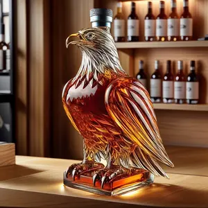 Hand Blown Eagle Shaped Glass Wine Bottle Container Made of High Borosilicate Glass with Vivid Yellow Painted Details on the Beak and Claws Features a Black Sealed Cap for Wine Storage Ideal for Packaging and Daily Use