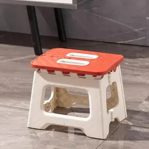 A compact folding stool with a handle, ideal for use in the kitchen, bathroom, camping, hiking, barbecues, and as an outdoor multi-functional tool