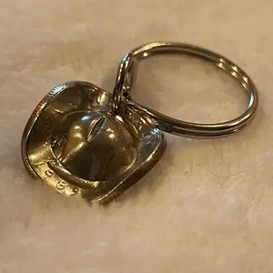 Cowboy hat keychain made from quarter